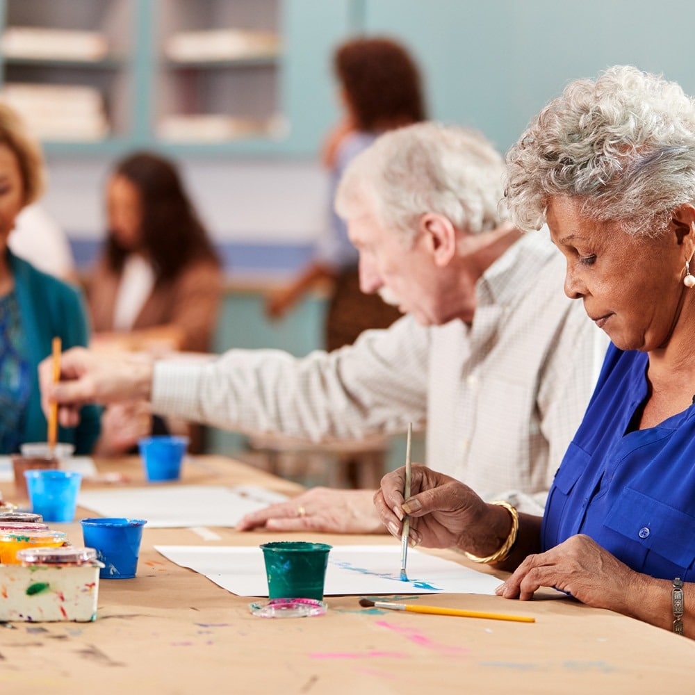 older people painting pictures