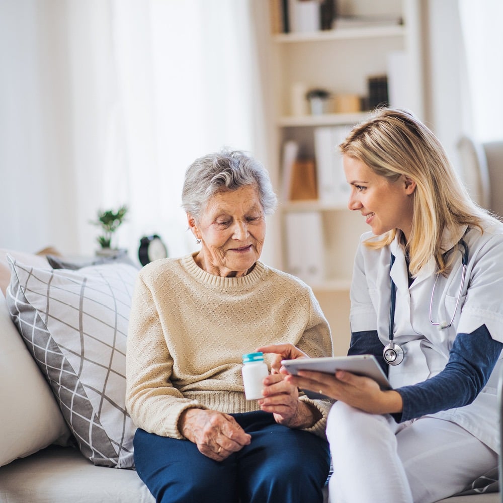 older woman talking to her nurse