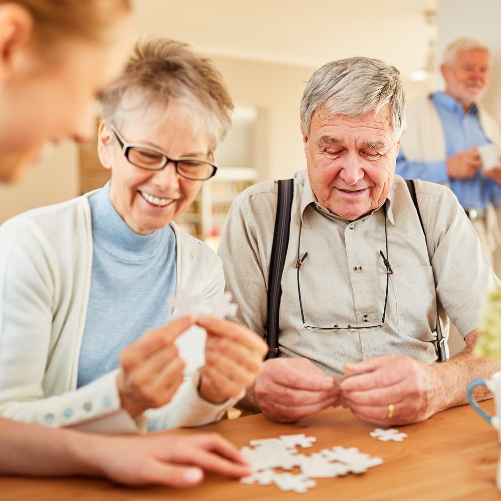 couple having fun putting together a puzzle