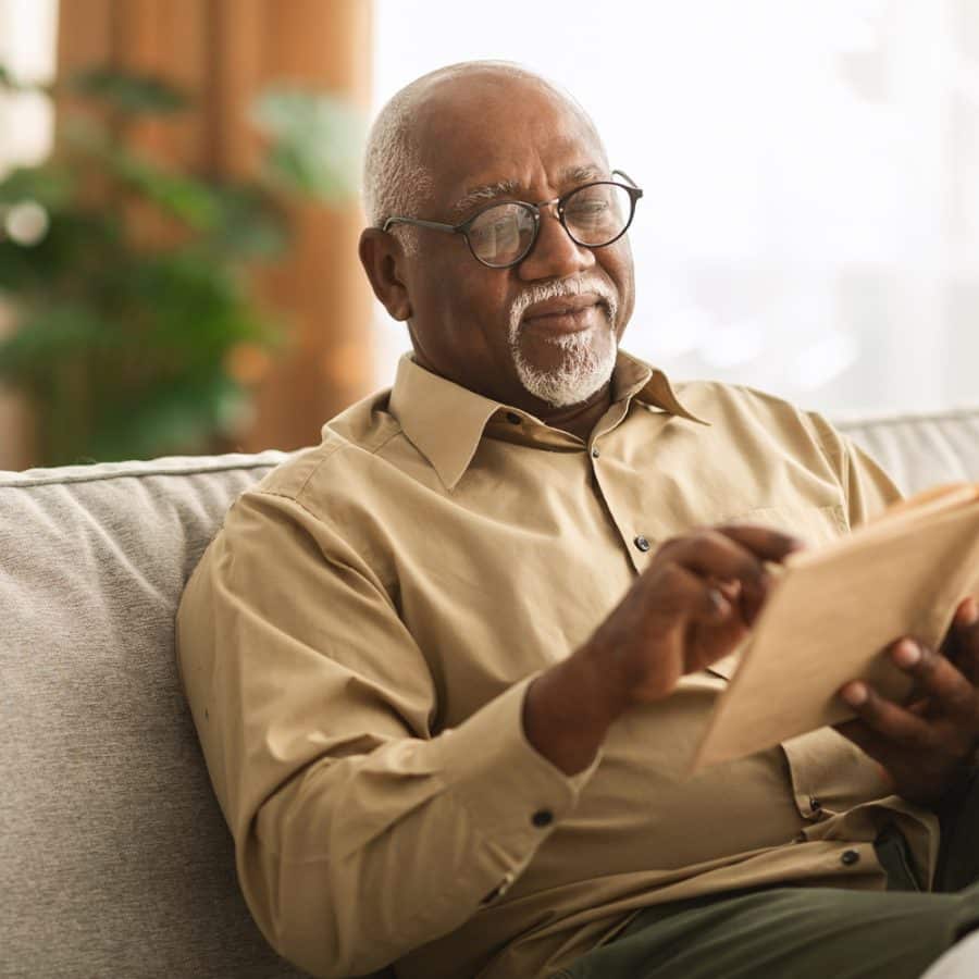 older man reading a book