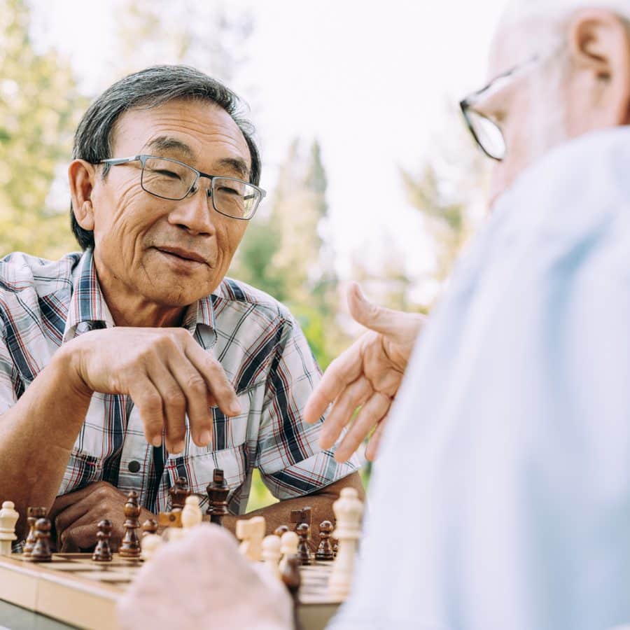 older gentlemen playing chess