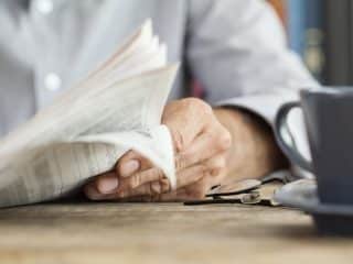 older man reading the newspaper