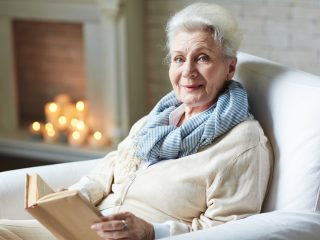 older woman reading a book