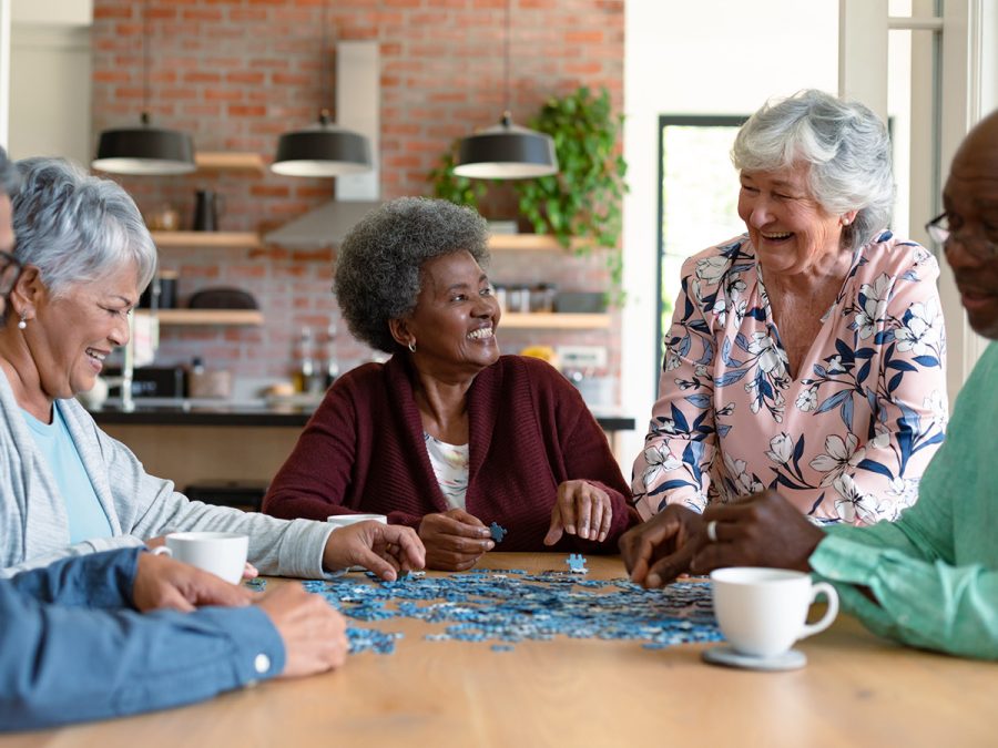 older people putting a puzzle together