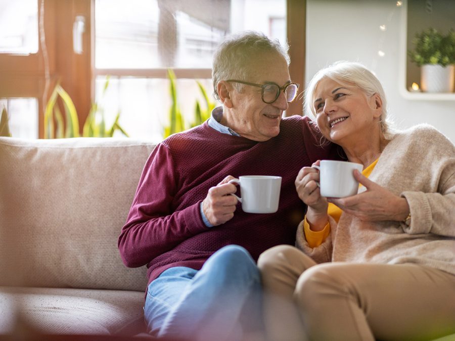 older couple enjoying some coffee and a laugh