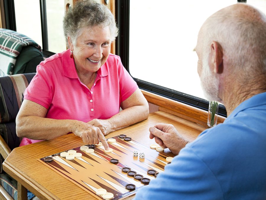 older couple enjoying a board game