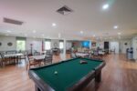 Red Cedar Glen activities room with pool table
