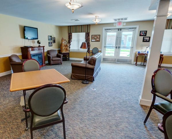 sitting area with fireplace and tv