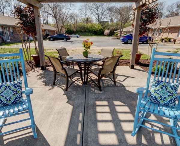 patio with furniture next to parking lot