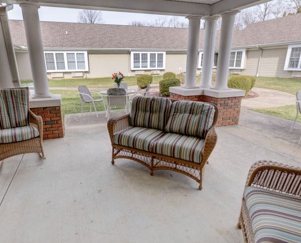 covered patio with wicker furniture