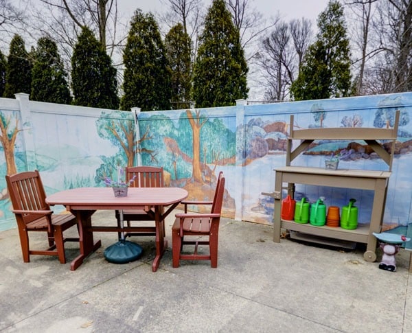 back patio with a gardening bench