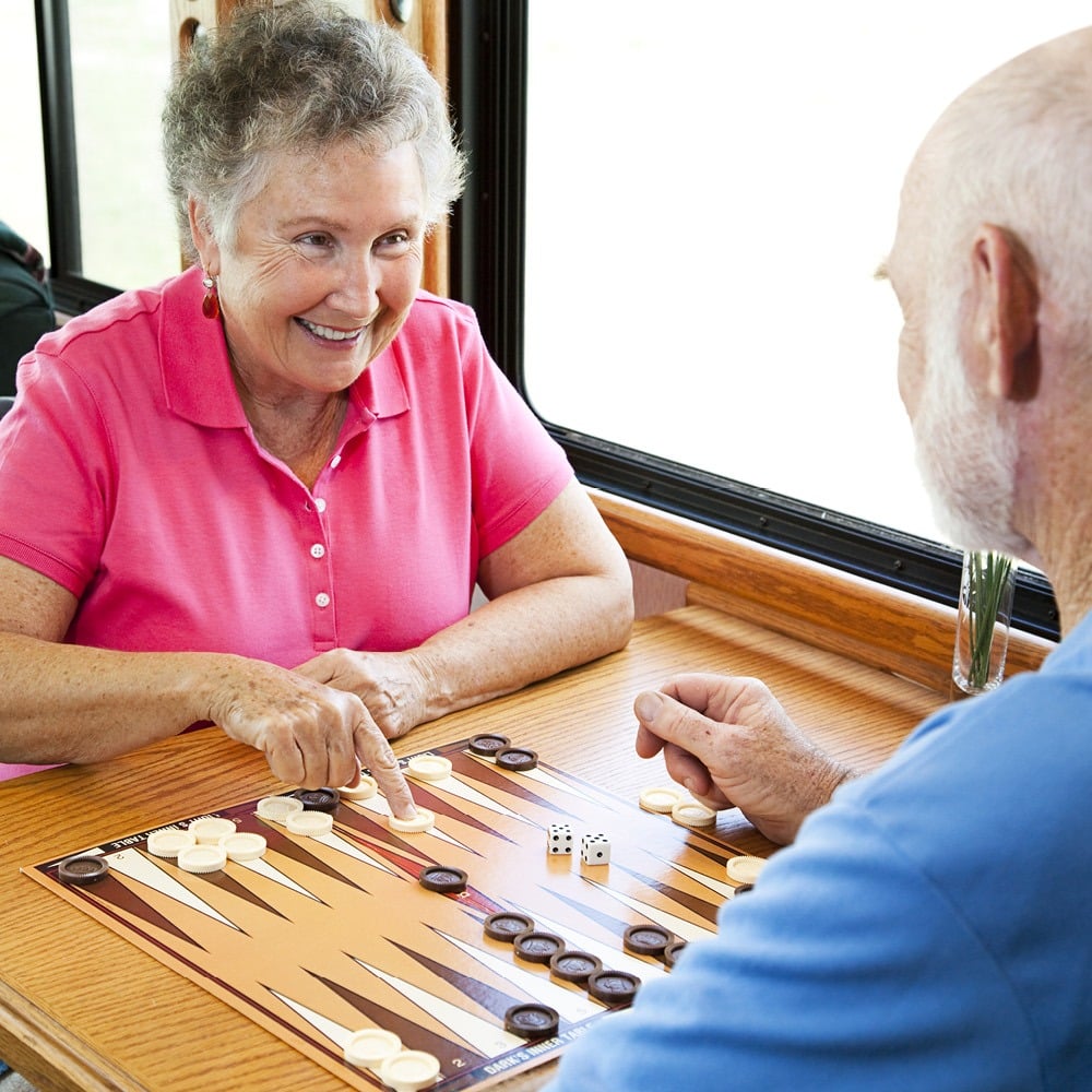 older couple enjoying a board game