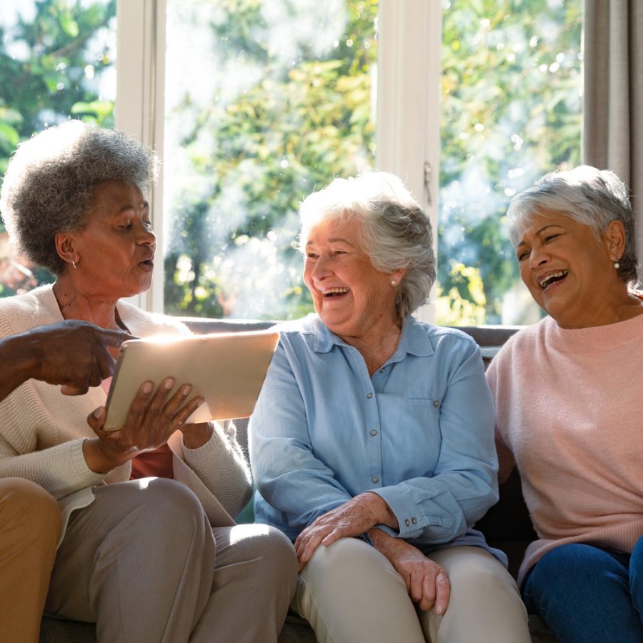 friends sharing a laugh on the couch