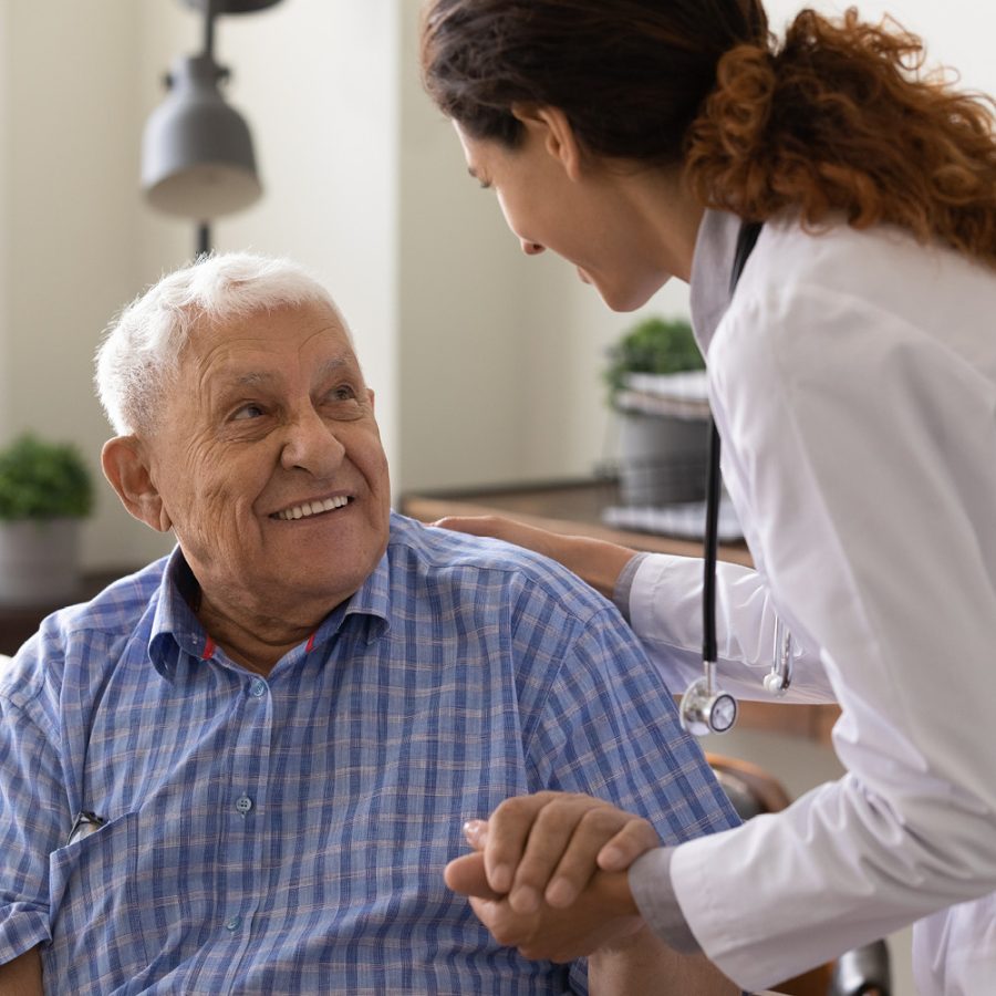 older man talking to his nurse