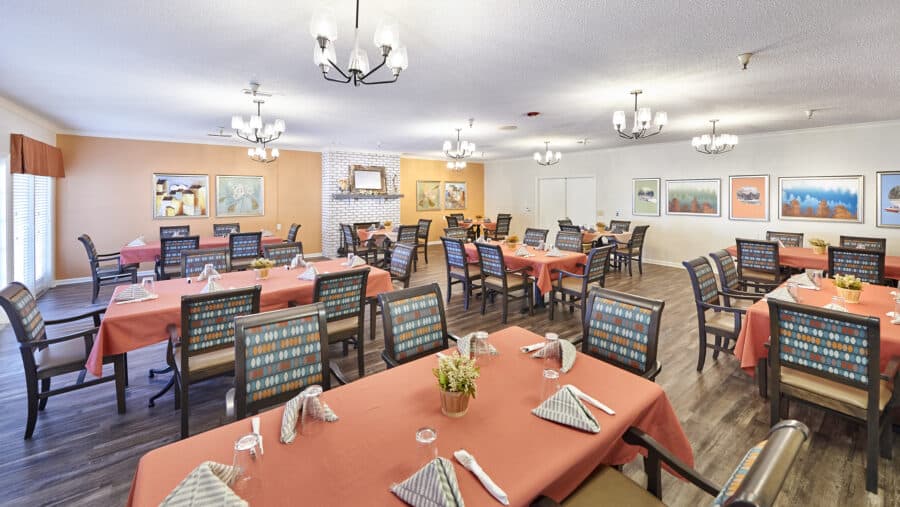 resident dining room with tables set for a meal