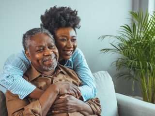 family hugging and smiling