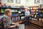 Two women residents shopping on the community store