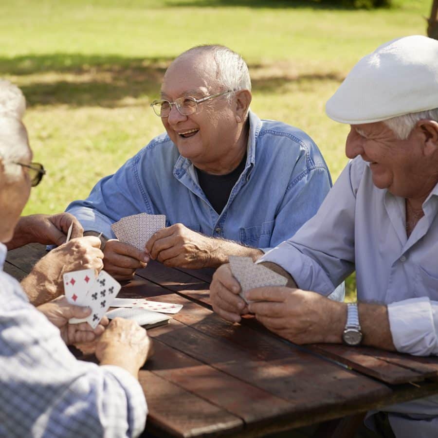 older gentlemen playing cards