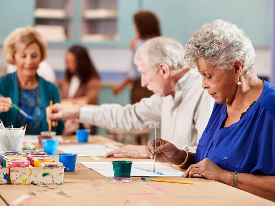 older people painting pictures