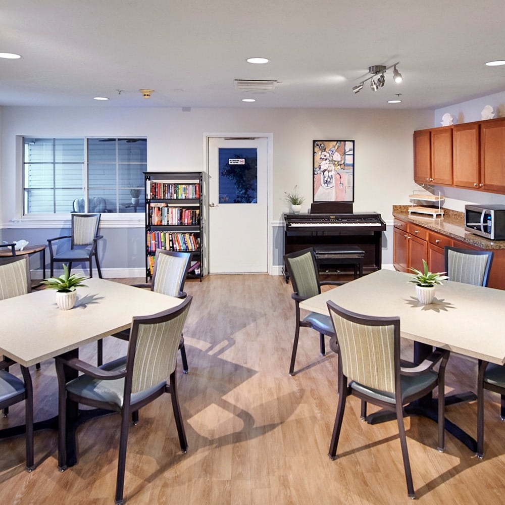 break room with books and a piano