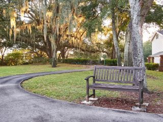 park bench next to a walking path