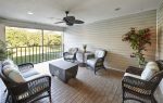 covered patio with wicker furniture