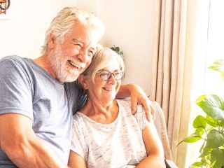 couple holding each other and laughing