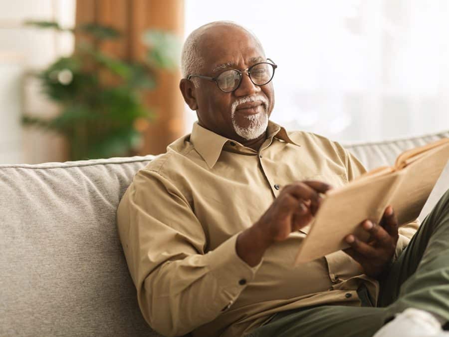 older man reading a book